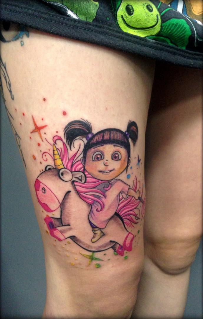 Tattoo of a girl riding a unicorn