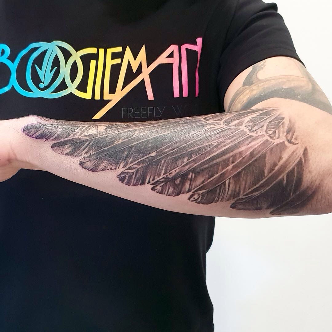 Raven wing tattoo by Virginie Tatouage